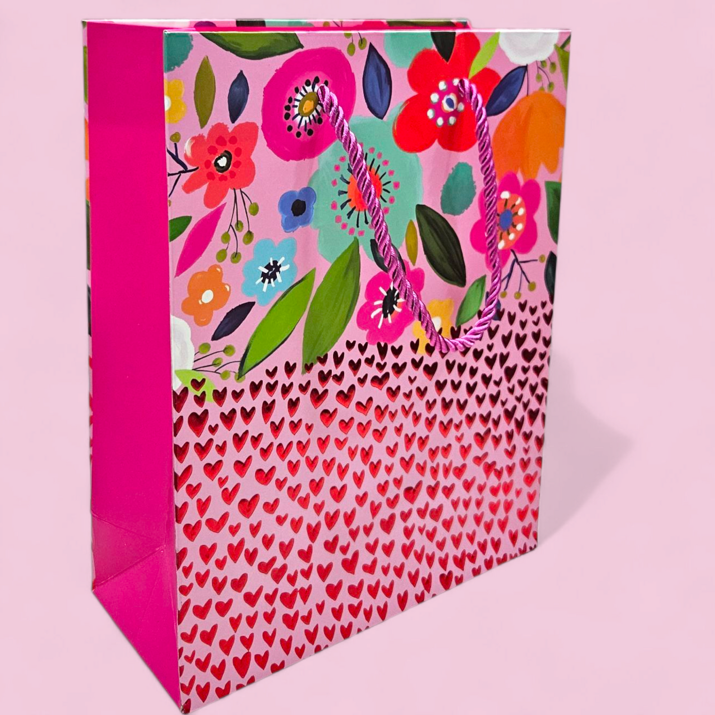 Goodie bag with red metallic hearts embossed